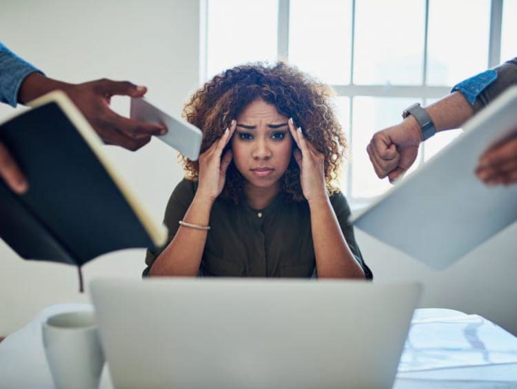 person putting hands on head stressed out