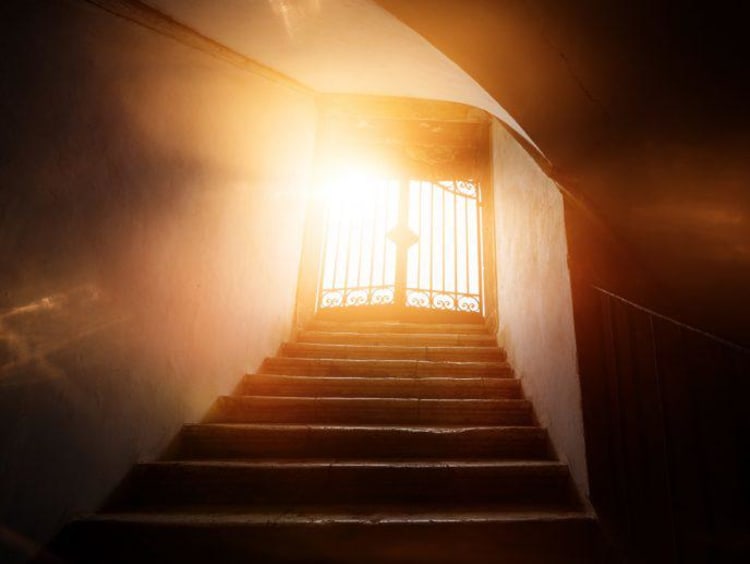 A doorway shrouded in light