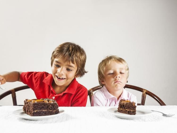 kids eating chocolate cake