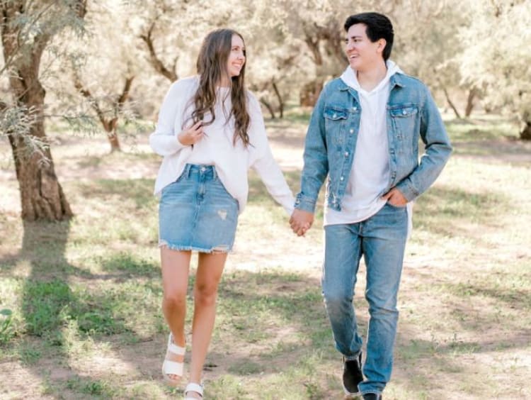 girl and guy holding hands