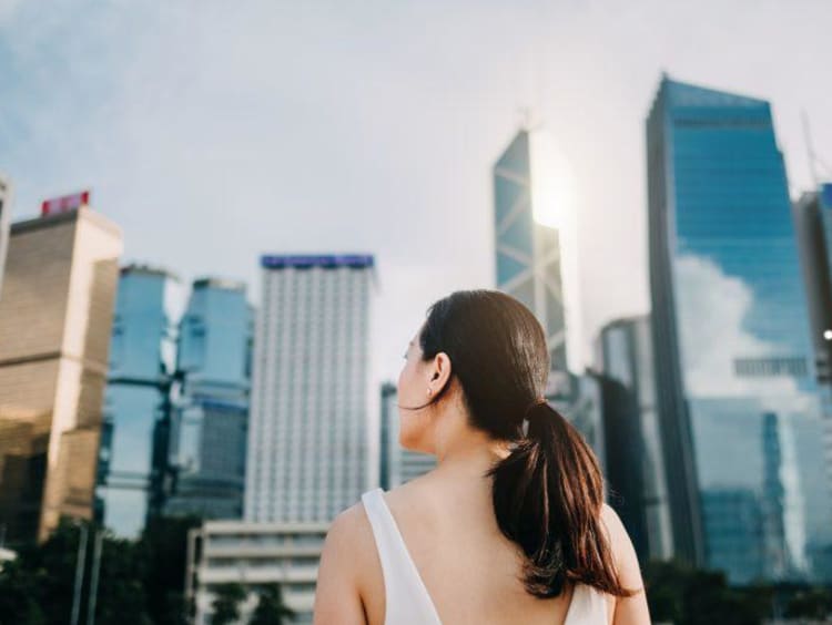 Girl looking at skyscrapers