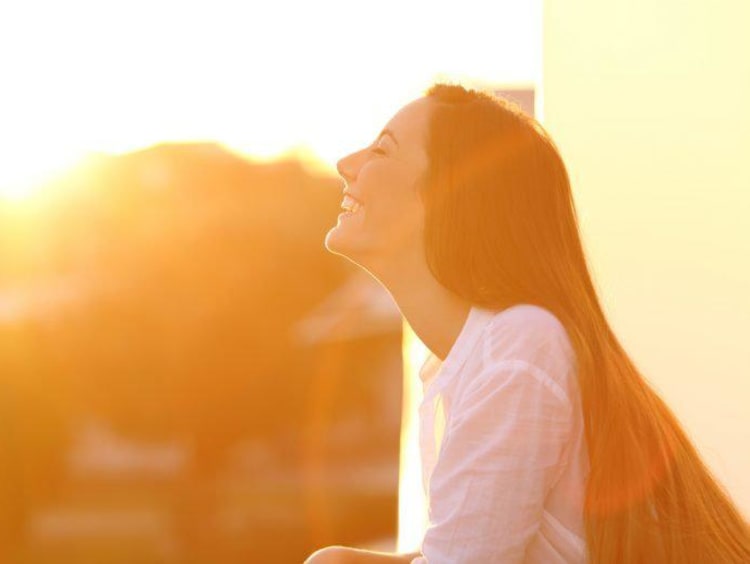 woman smiling in sunlight
