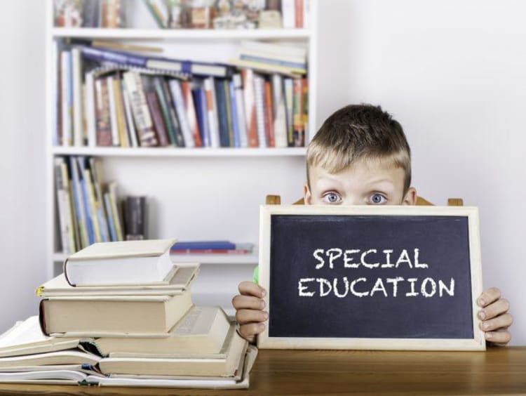 little boy with chalkboard