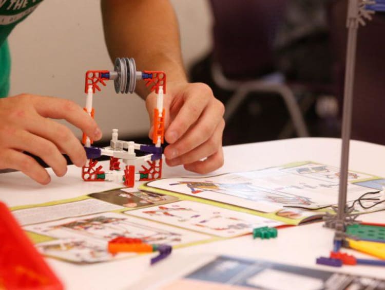 stem student building a prototype