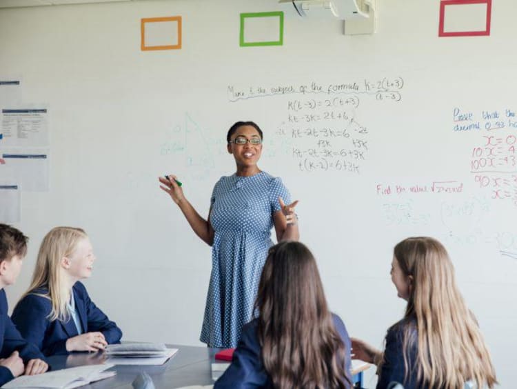 a teacher teaching math to her class