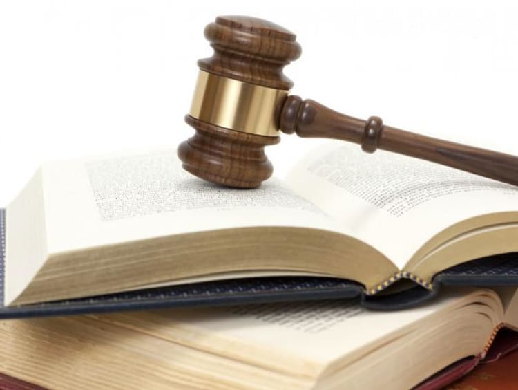 a gavel on top of a book