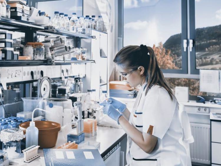person working with chemicals in a lab