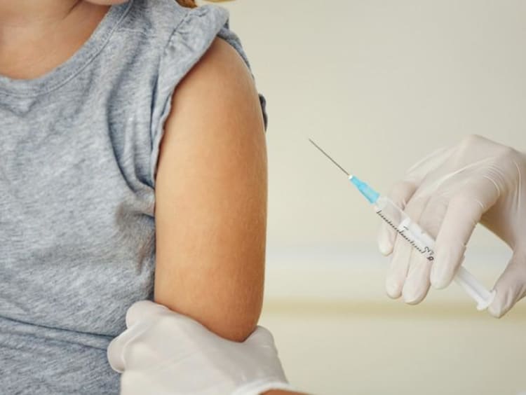 person getting a shot from the doctor.