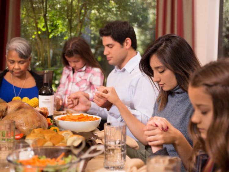A family at the table on Thanksgiving