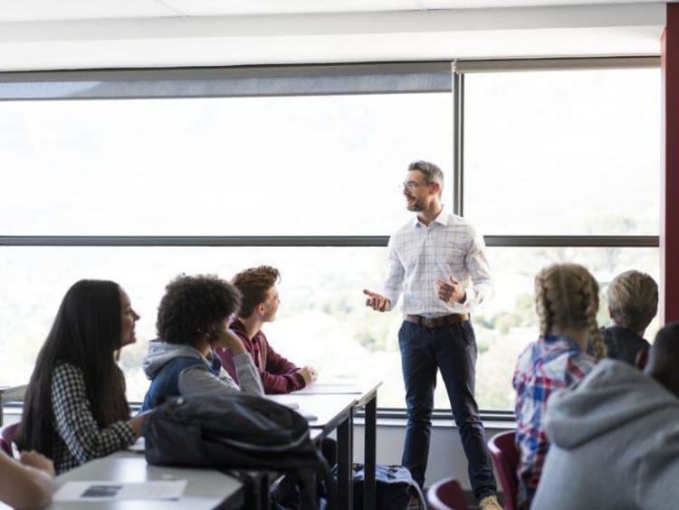 Adult Male Instructor teaches young adults