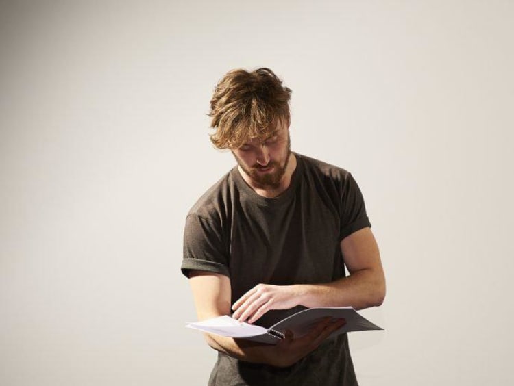 Guy reading script