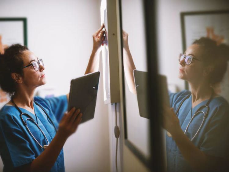 Nurse working with a tablet
