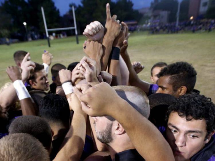 sports team in a huddle