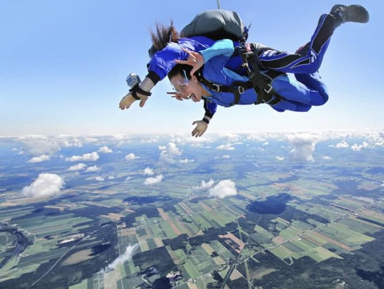 two people sky diving