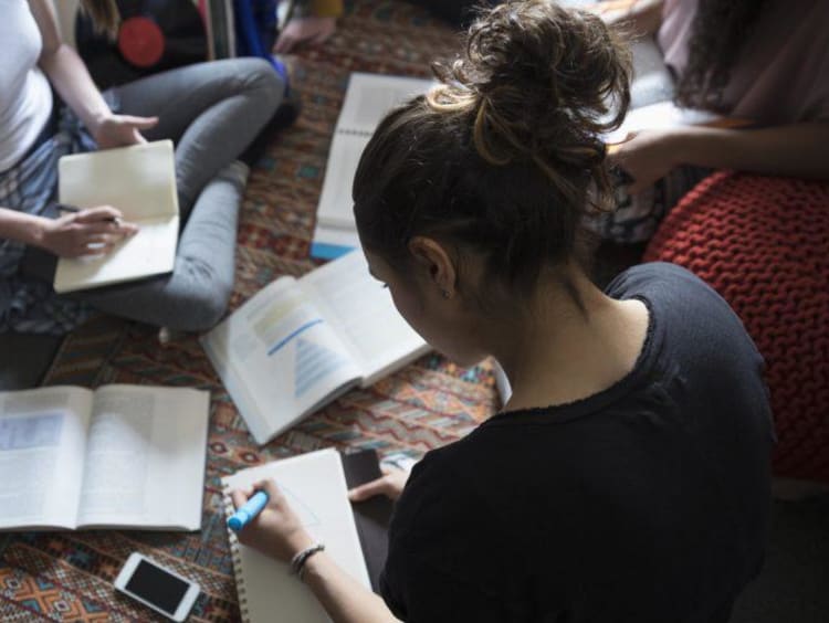 Woman studing with open books
