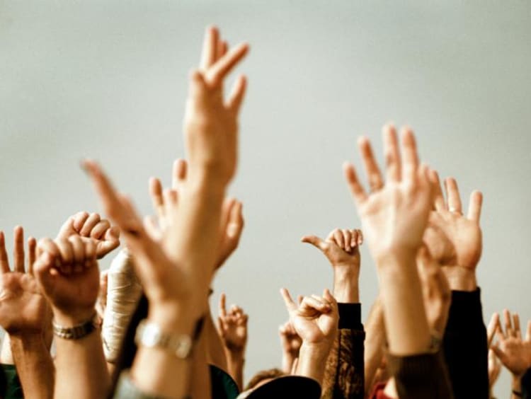 Hands raised in the air