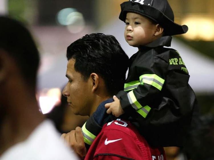 Father with little child on his back