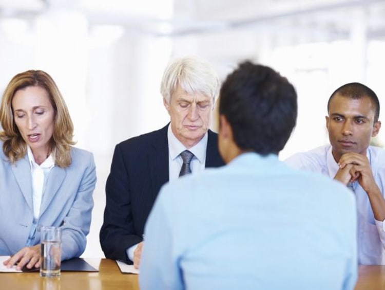Man gets interviewed by executive leadership