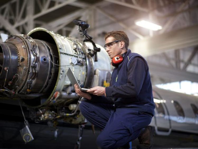 Man working on airplane