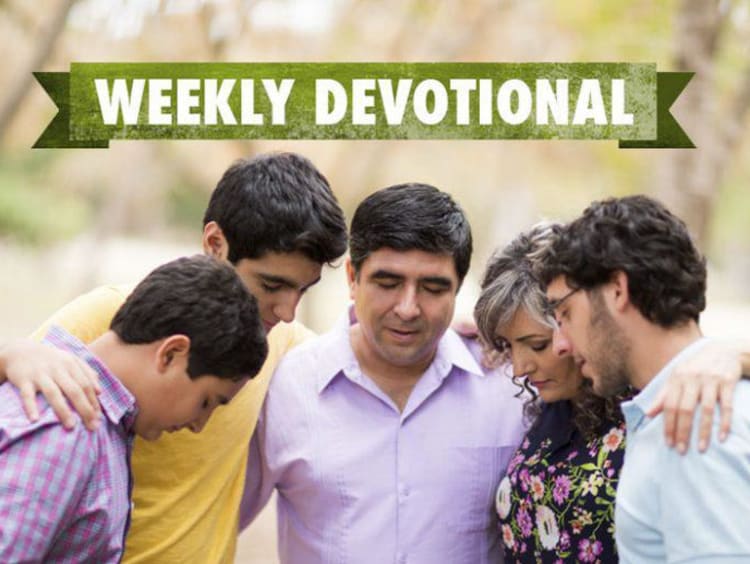 group of people praying.