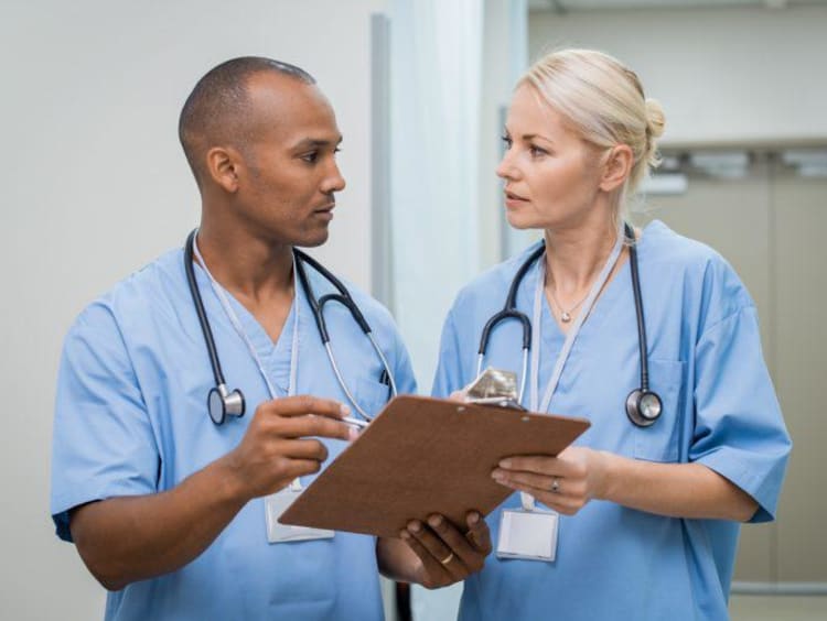 two nurses talking