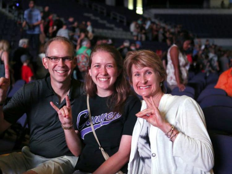 parents and student holding a lopes up