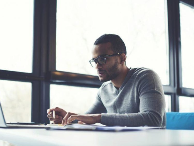 man typing on the computer