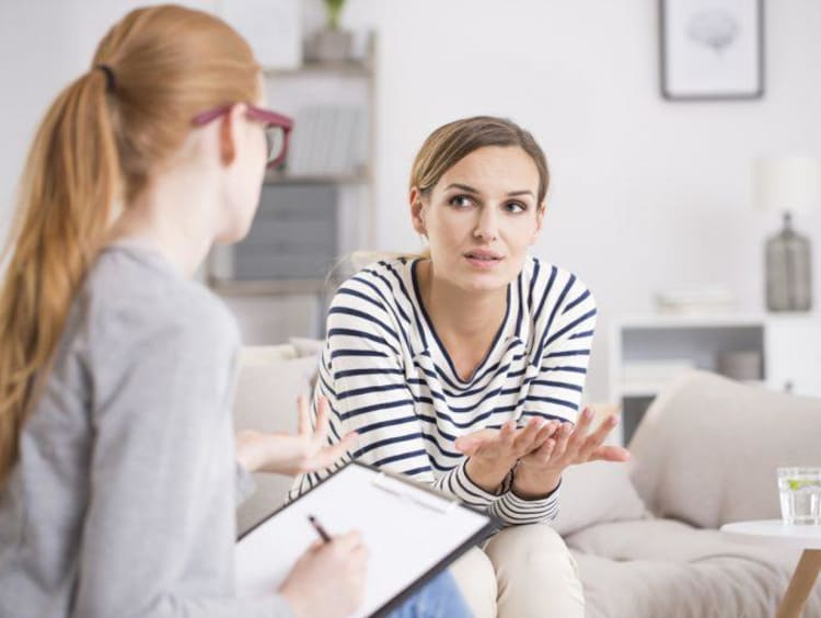 A counselor talking with a patient