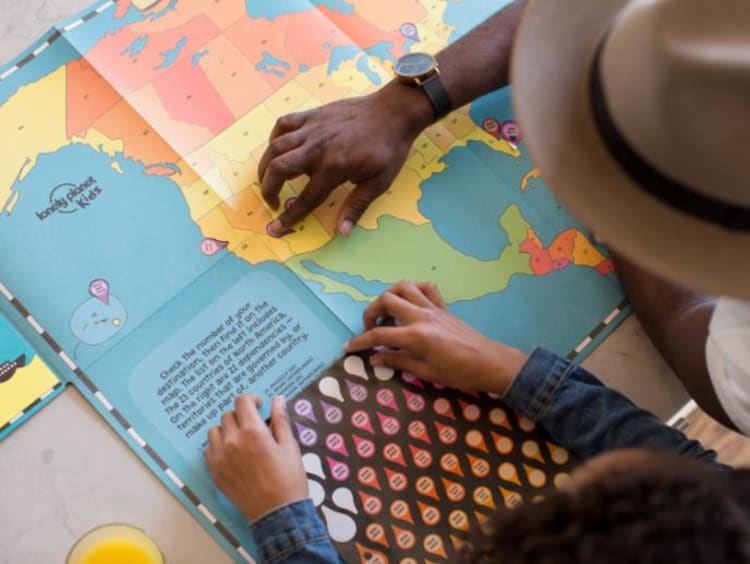 Student and teacher looking at a map