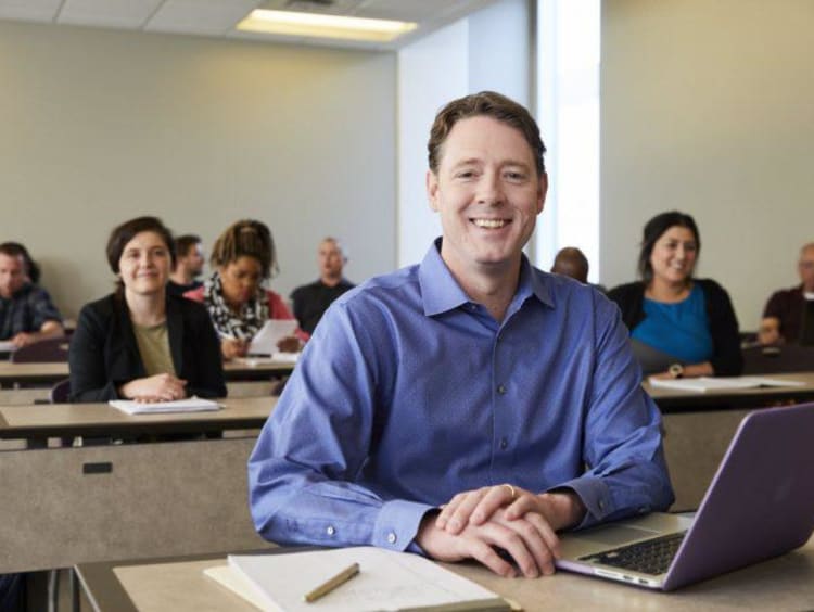 An adult learner in a GCU classroom