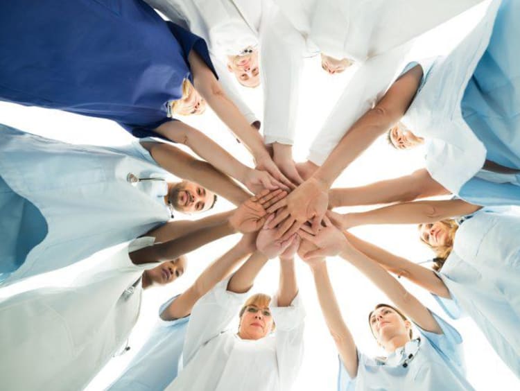 team or nurses in a huddle