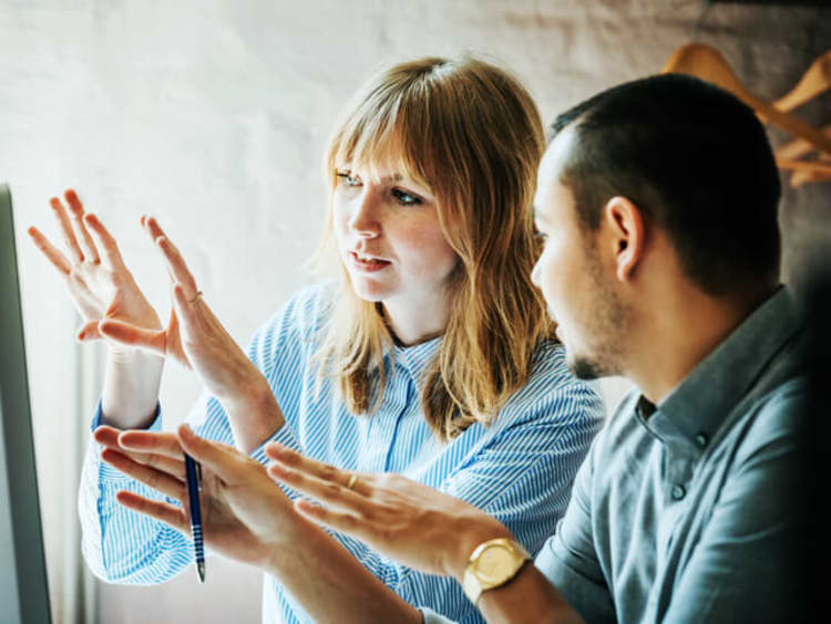 communication specialists problem solving together in an office