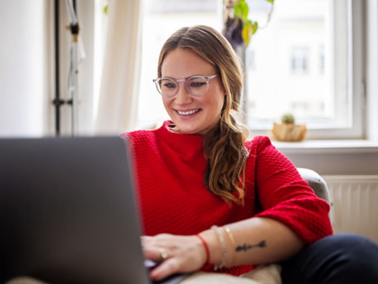 Editor typing on laptop and gaining experience