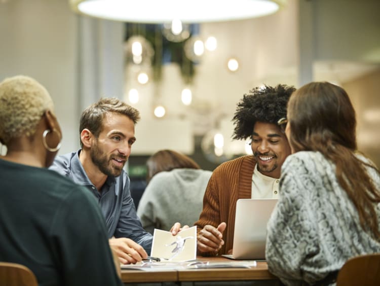 Coworkers at table working with purpose