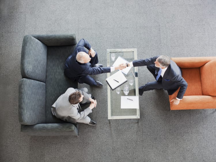 Businessmen having a human capital strategy discussion