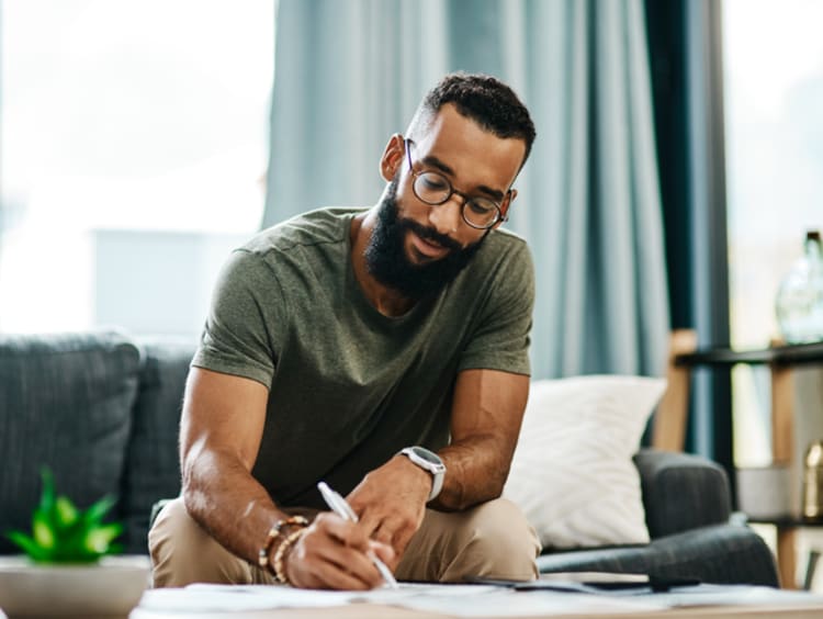 male student earning online business degree from home