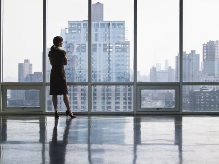 Businesswoman looking out window