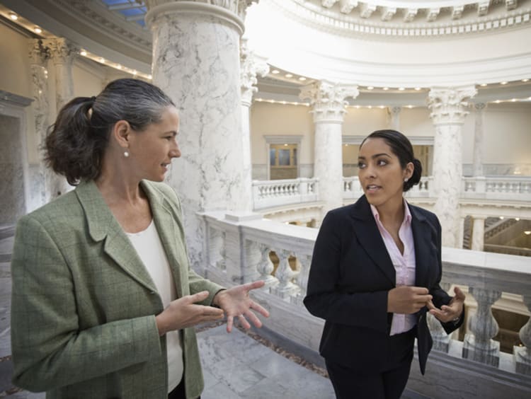 two female political science professionals in court house