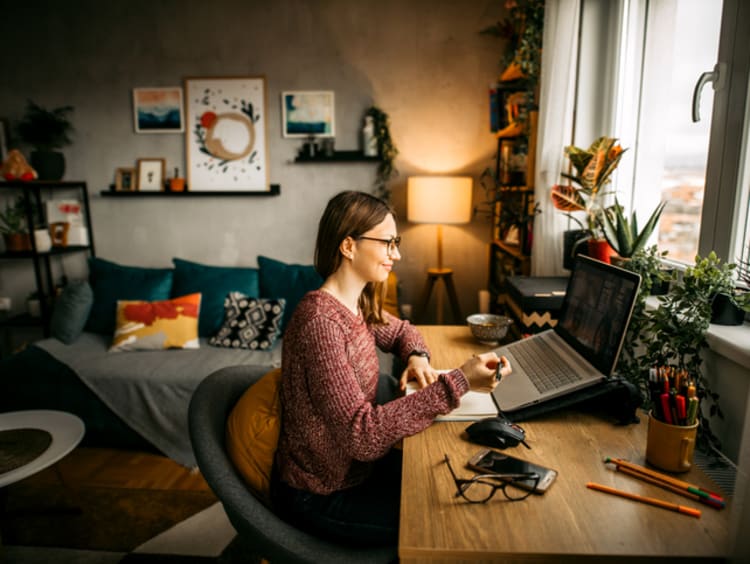 Woman working remotely from home office