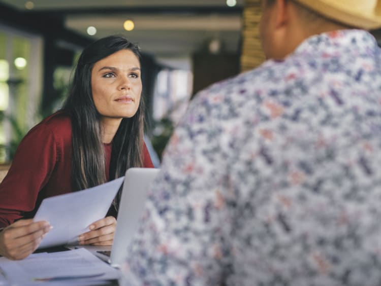 A doctoral student conducting an interview to collect quantitative data