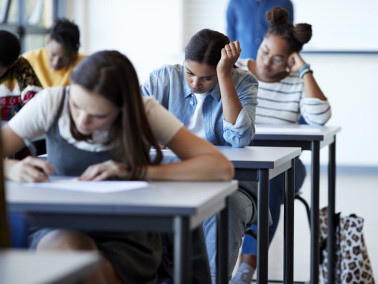 student doing classwork at school