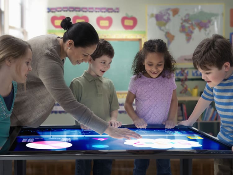 Diverse students interacting with an electronic map