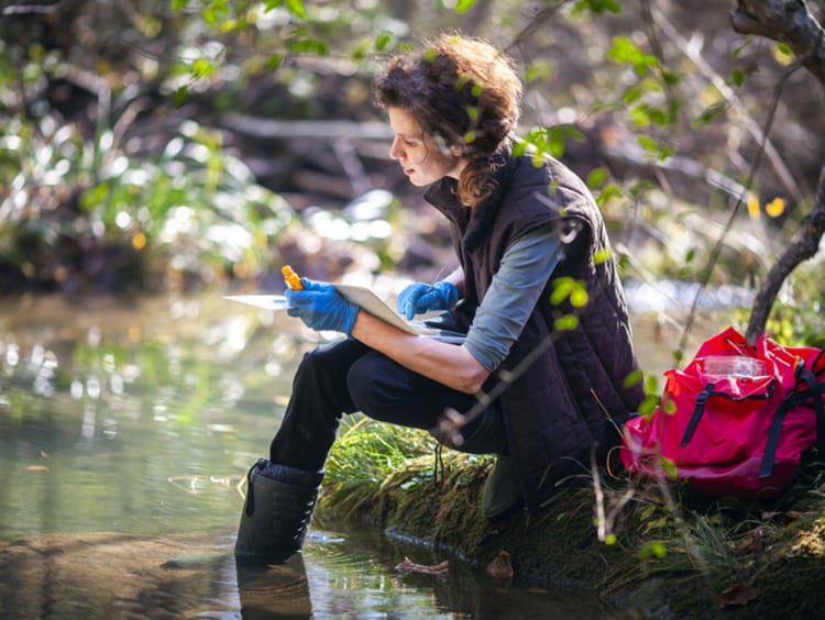 An environmental scientist taking water samples