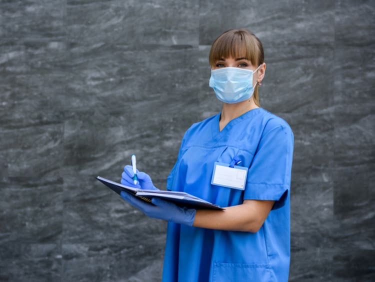 Medical assistant taking notes
