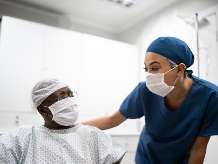 Nurse encouraging patient during a nursing intervention