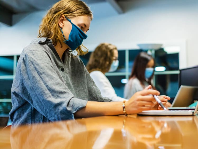 female nursing student studying for NCLEX exam