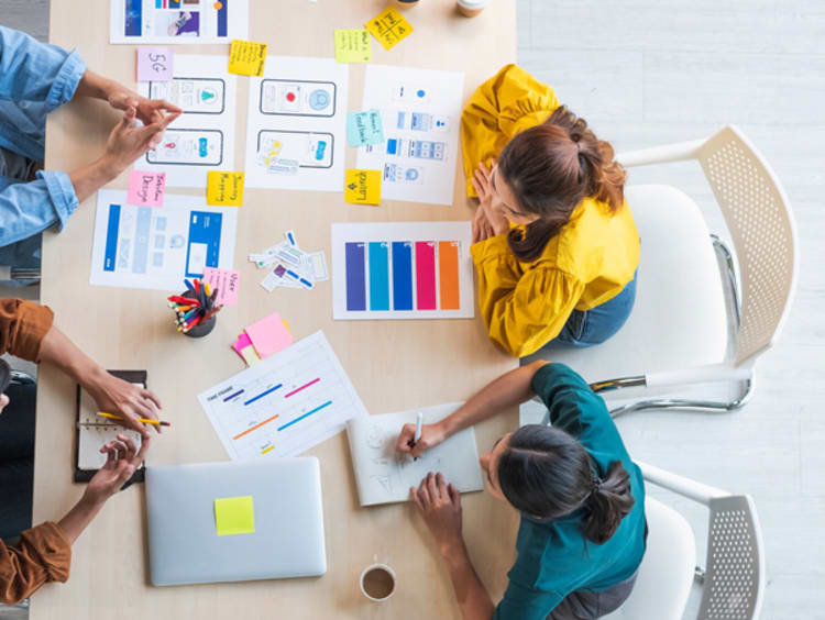 A group of web designer collaborating on designs