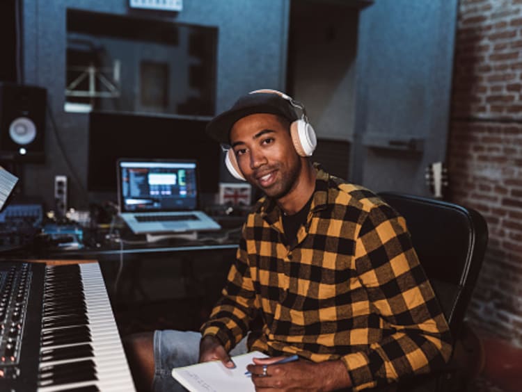 Composer writing music in studio
