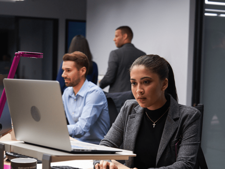 male and female computer scientists working in lab