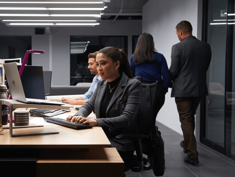 Employees work and discussion in office meeting setting
